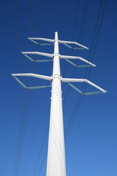 White high voltage electricity tower and power lines.