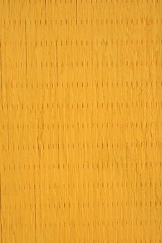 Painted wooden texture of vibrant yellow color