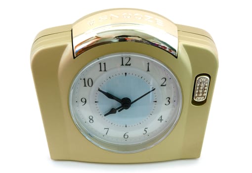 Alarm clock (with gold plastic body) on overwhite background.