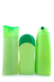 Three different  green beauty and hygiene products. On overwhite background.