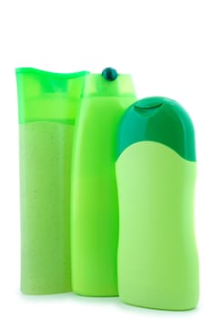 Three different  green beauty and hygiene products. On overwhite background.