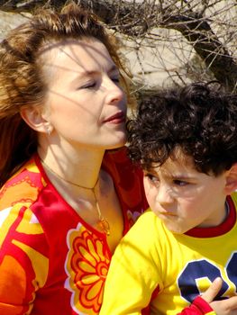 Mother and child at the seaside in springtime