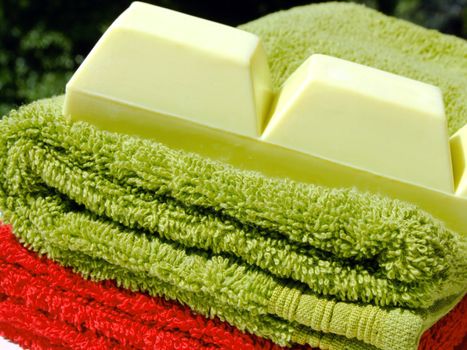 Two towels and a piece of soap
