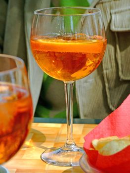 Glasses and snacks on a cocktail bar table