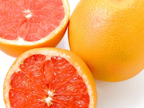 Close-up of a half cut ruby grapefruit