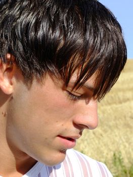 Portrait of a twenty years old dark-haired boy