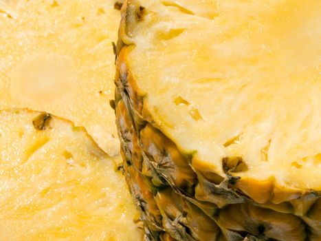 Close-up of half and two slice of pineapple 