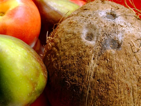 Close-up of fresh mixed fruit: coconut, peaches and figs