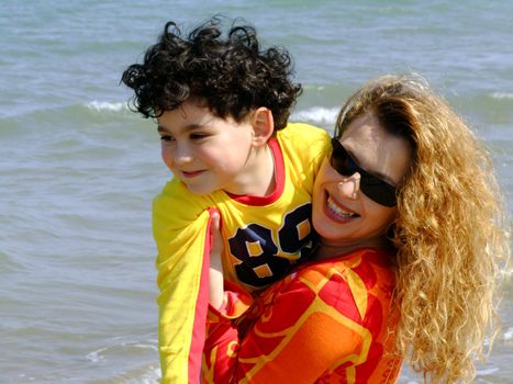 Mother and child playing on the beach