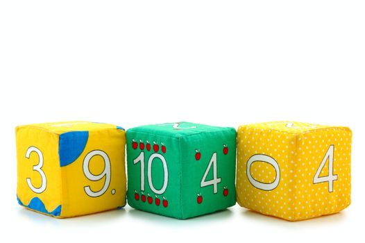 Child's cloth mathematical bricks (blocks) on overwhite background. 