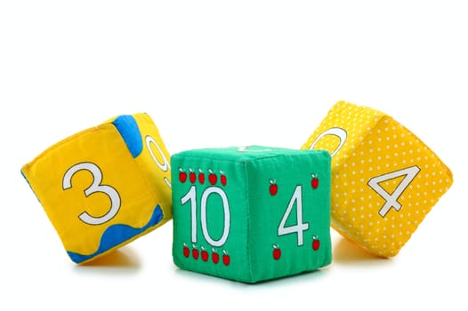 Child's cloth mathematical bricks (blocks) on overwhite background. 