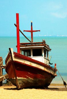 Fishermans boats on the ocean coast. Sun sand and sea.