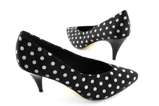 Black retro high heel polka shoes on white background.