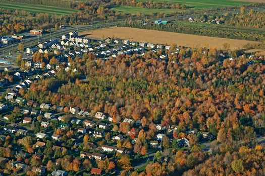 View over suburban neighborhood in bright colors of autumn.