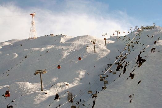 Alpine ski lift in Swiss Alps.