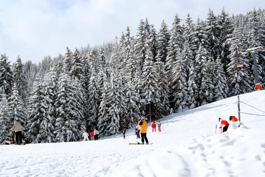 Skiers on mountain slopes, Switzerland.