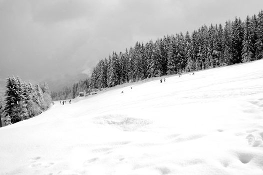 Skiers on mountain slopes, Switzerland.