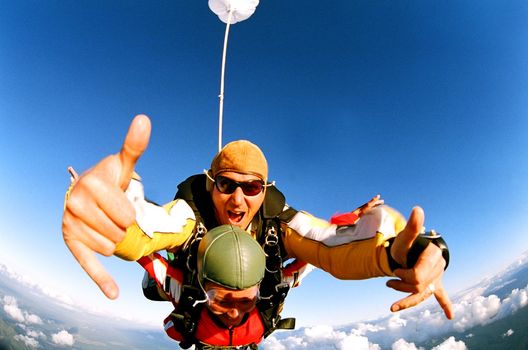 Tandem skydiver in action parachuting.