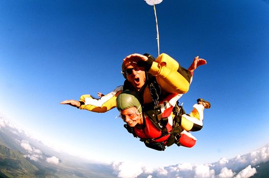 Tandem skydiver in action parachuting.