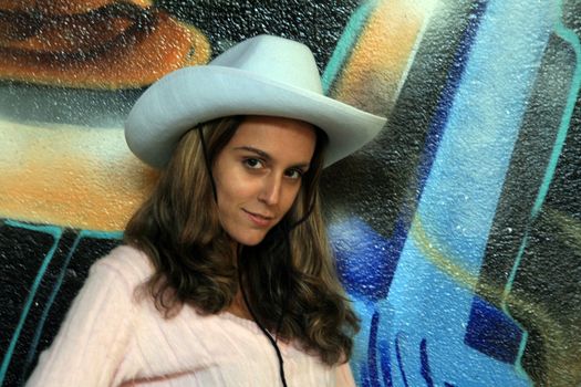 cowboy fashion girl in graffiti background