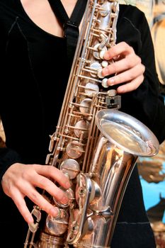 hands of musicinan playing Saxophone