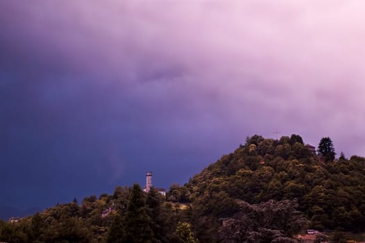 Castle on mountain with very dramatic sky and copy space