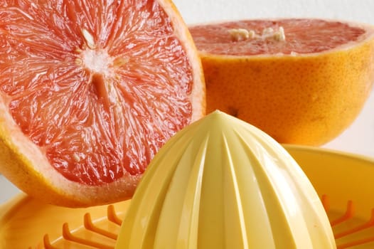 Grapefruit and squeezer