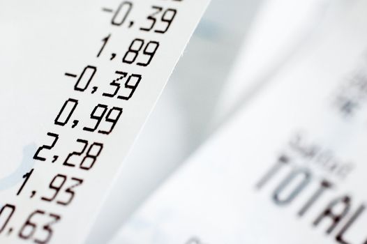 Close-up of shopping receipts with very shallow depth of field