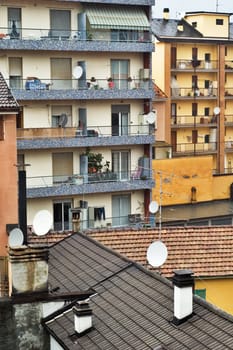 Cityscape with buildings with tv satellite dishes