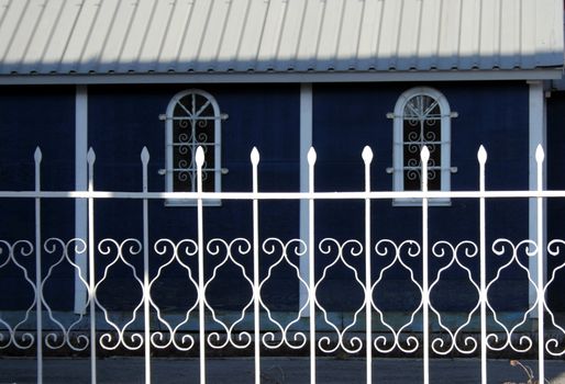 Metallic fence beside the church