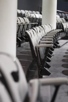 Seats and tables in a conference room.