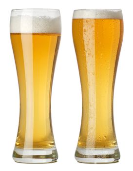 Photo of two tall glasses of beer, one with condensation and one without. Clipping path included. Two photographs merged.