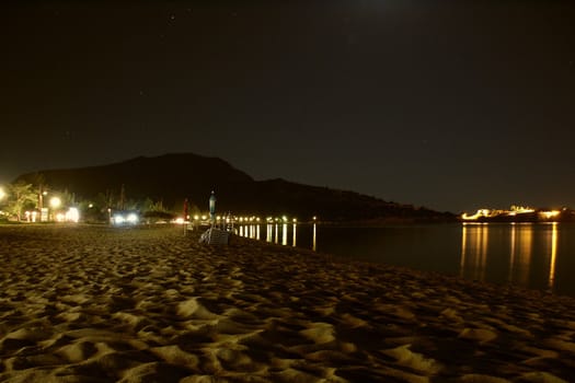 night shot of greece sea and beach with night sky and beach