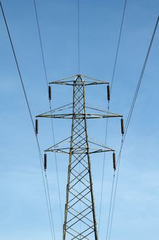 A electrical pylon with a blue sky