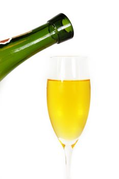pouring some white wine in glass, isolated on white