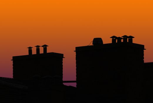 silhouette of roof top in sunset