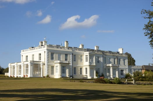 A large white house in the countryside