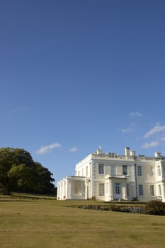 A large white house in the countryside