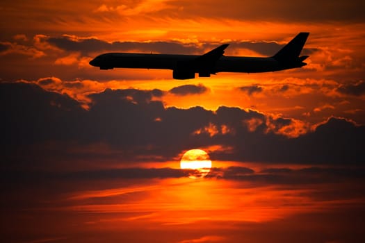 Plane Silhouette against Setting Sun