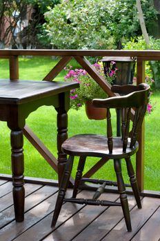 empty well decorated open air cafe with lots of green plants