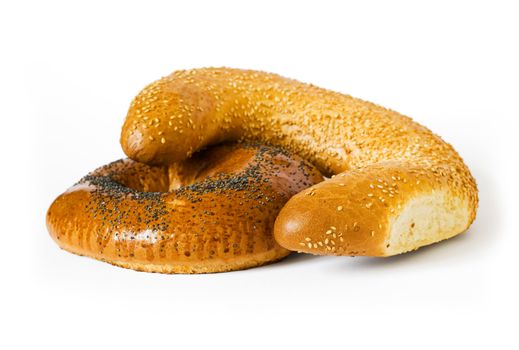Isolated white bread with poppy and sesame seeds. Objects with shadow on white background. Clipping path included to remove object shadow or replace background.