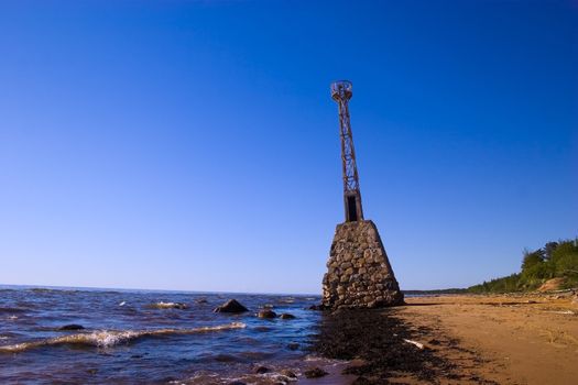 Old abandoned lighthouse already in the water