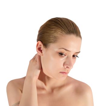 young woman putting make up on her face. Isolated