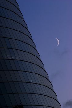 Modern Office building exterior in dusk and moon