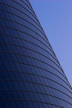 Office builidng in the evening. Skyscraper windows