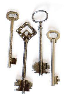 Isolated old fashioned skeleton keys on white background. Clipping path included to ease remove object shadow or replace background.