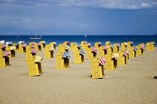 Beach wicker chairs with numbers on back in Germany near Baltic sea