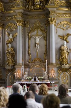 Worship service in traditional church near altar