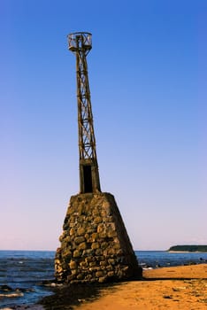 Old abandoned lighthouse already in the water