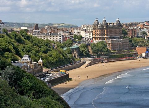 Scarborough is an English town by the sea, popular in Summertime for holidays.